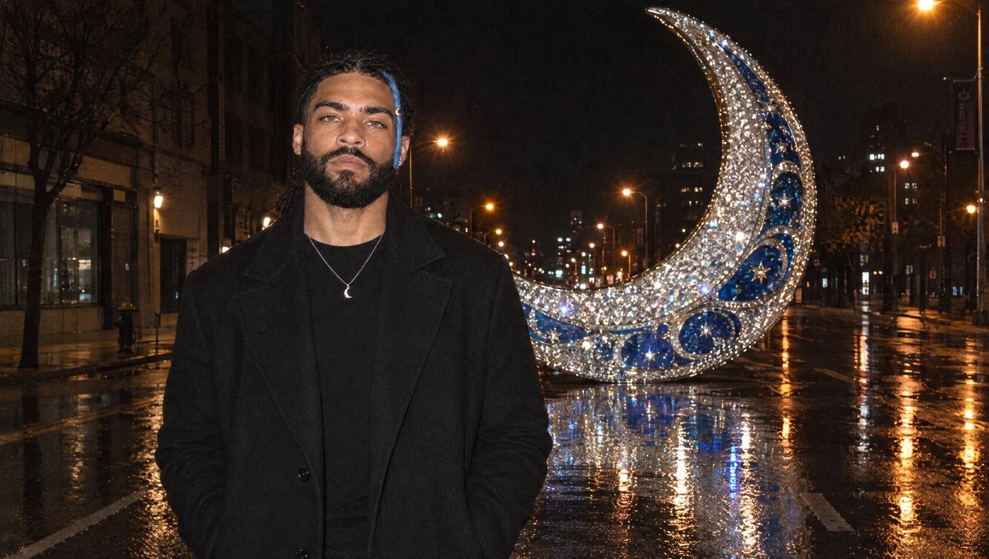 Standing in a wet city street at night, hands in his coat pockets, a giant crystal crescent moon standing in the road behind him.